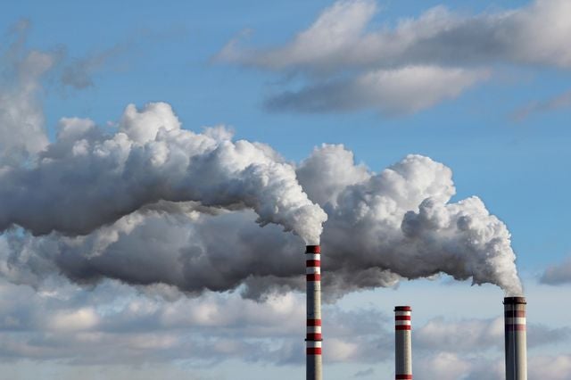 Smoke coming out of smoke stacks.