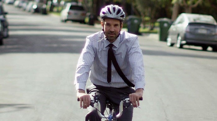 Photo of UCLA Professor Alex Hall on a bike.