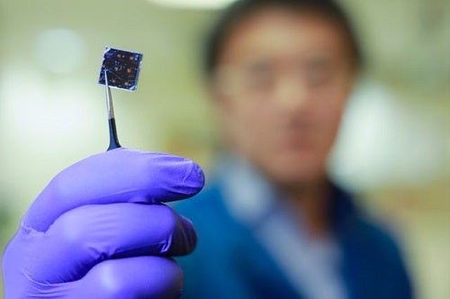 A solar cell being held by someone