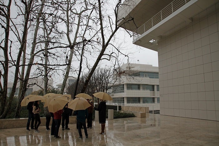 A group of people with umbrellas at UCLA on a rainy day