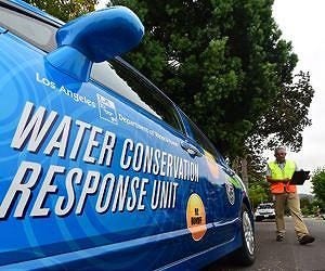 Side of a vehicle that reads "Water Conservation Response Unit."