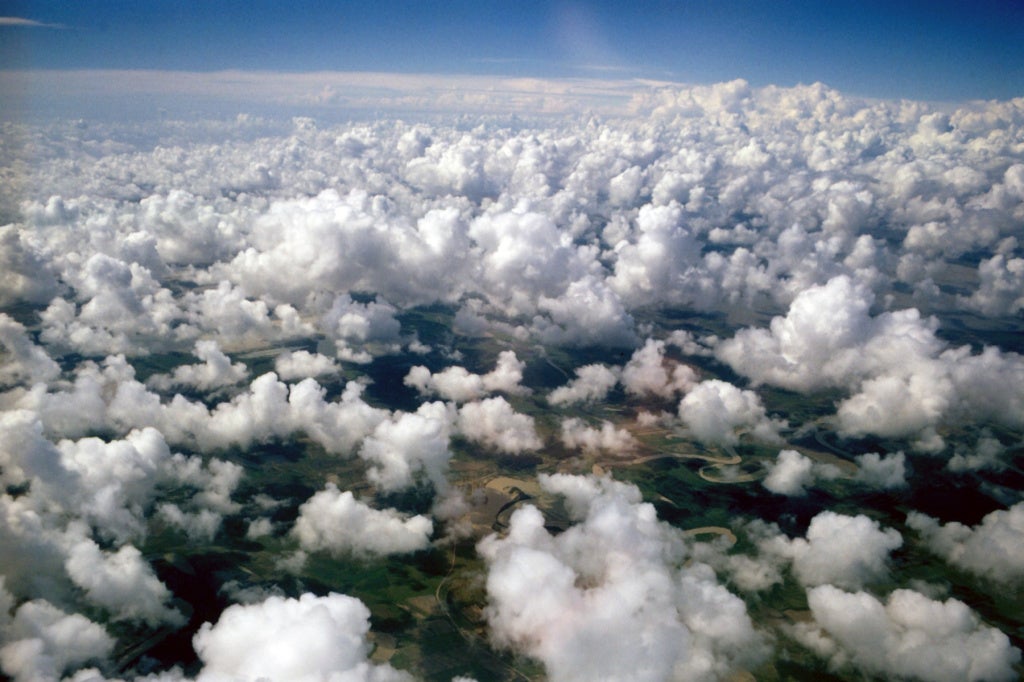 Clouds above land.