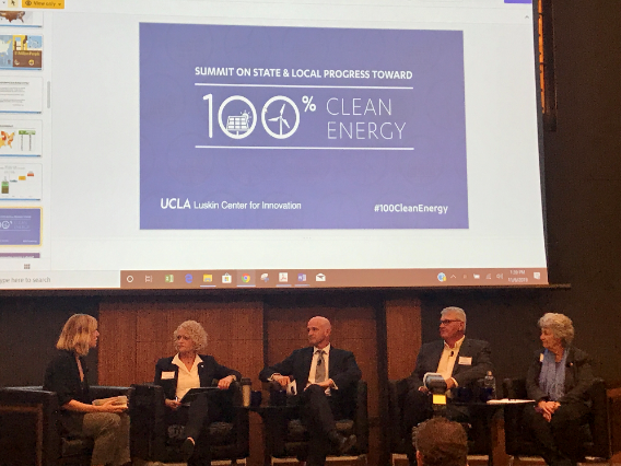 Photo of panel members at the Summit on State & Local Progress Towards 100% Clean Energy
