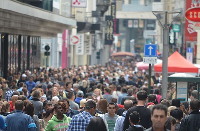 A busy street packed with people.