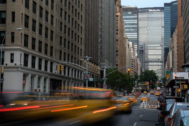 A long exposure photo of a busy street.