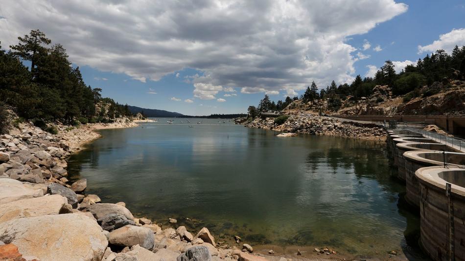 After several years of drought, the rocky shoreline of Big Bear Lake is exposed near the dam on July 27.