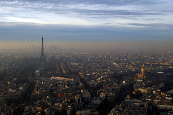 The Eiffel Tower and The Invalides dome, right, are seen from the Montparnasse Tower, as Paris suffered a pollution spike this week.