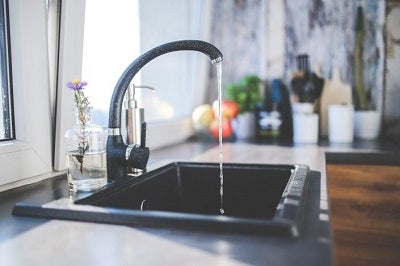 a sink with water running