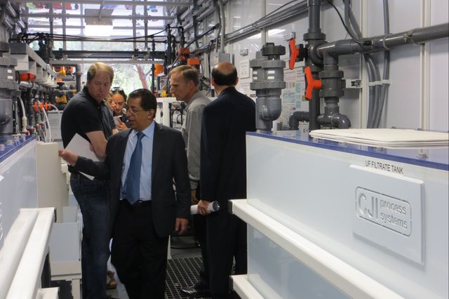 UCLA engineering professor Yoram Cohen inspects a mobile water treatment plant he designed to reduce the costs of removing salt and harmful solids out of brackish groundwater and agricultural runoff.