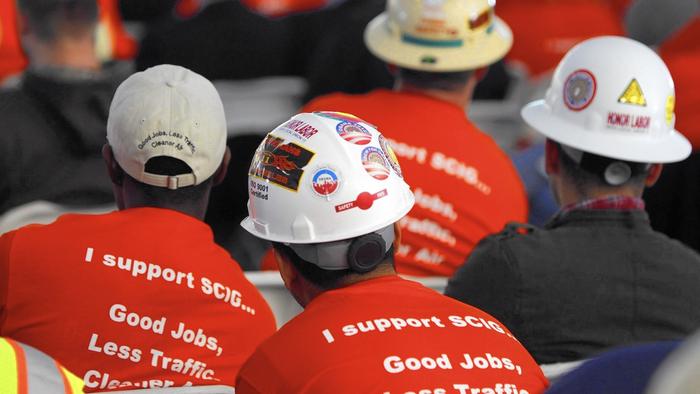 Members of the International Brotherhood of Electrical Workers union show their support for BNSF Railway’s proposed Southern California International Gateway (SCIG) facility during a public hearing in San Pedro in 2013