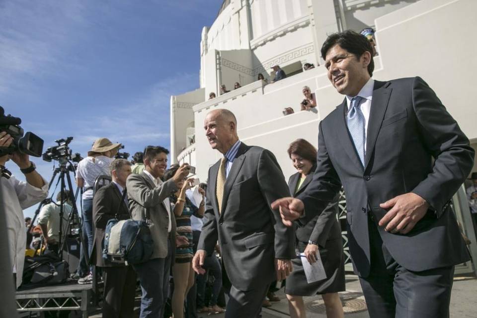 Gov. Jerry Brown, center, arrives last October at Griffith Observatory with Senate President pro Tem Kevin De León, right, and then-Assembly Speaker Toni Atkins, to sign landmark legislation to increase the state’s renewable electricity use to 50 percent and doubling energy efficiency in existing buildings by 2030.