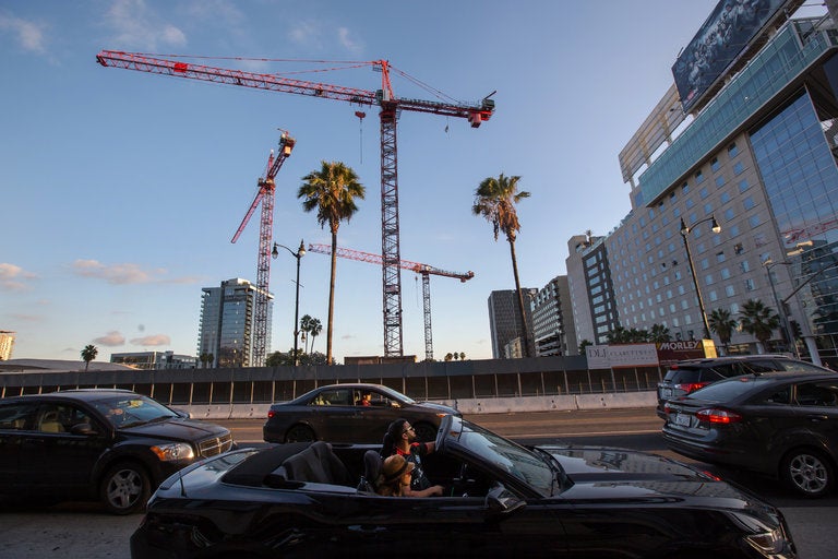Construction cranes above Hollywood Boulevard in Los Angeles. A building boom in mixed-use developments, luxury hotels, shopping centers and high-rise condominiums is spreading across the city.