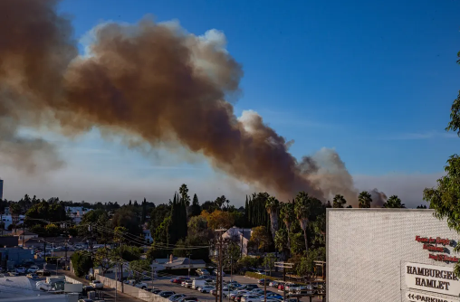 The beginnings of a fire in Sherman Oaks, California, fills the skyline with smoke.