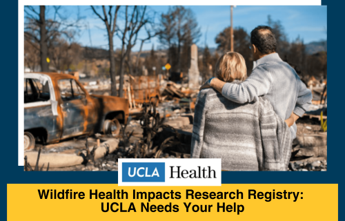 A couple stand looking at a burned down home
