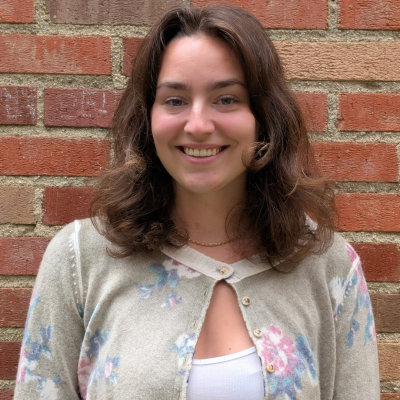 A young woman smiling at the camera.