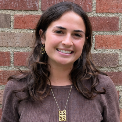 A young woman smiling at the camera.