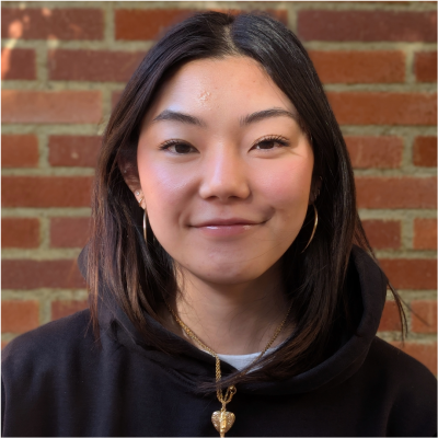 A young woman smiling at the camera.