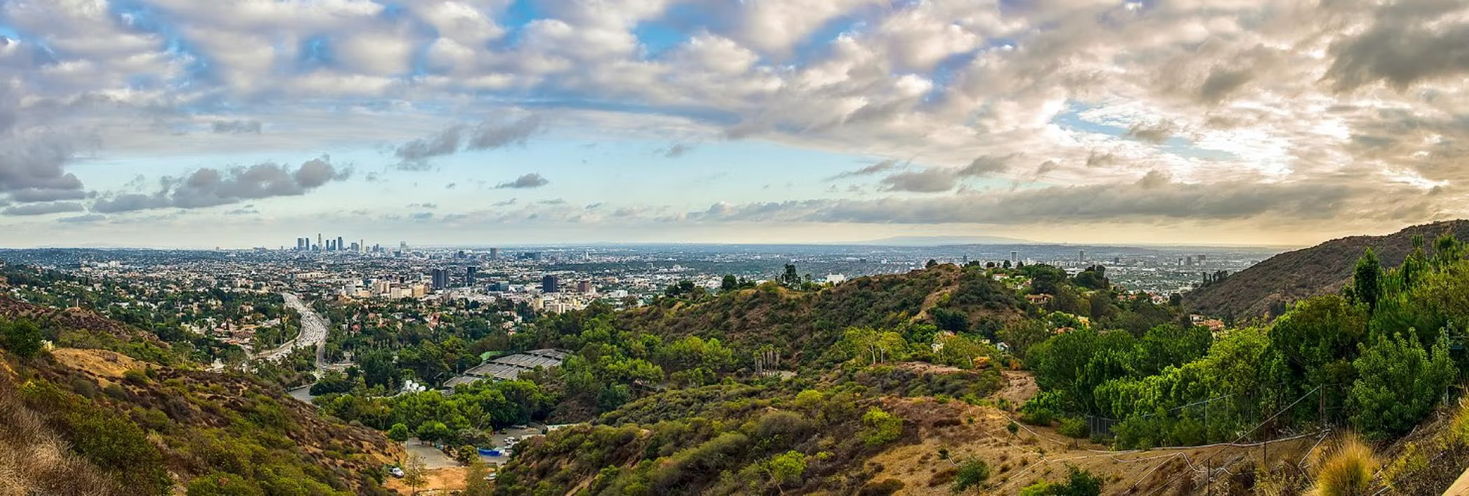 A panoramic shot of the Los Angeles skyline from the Hollywood Hills.