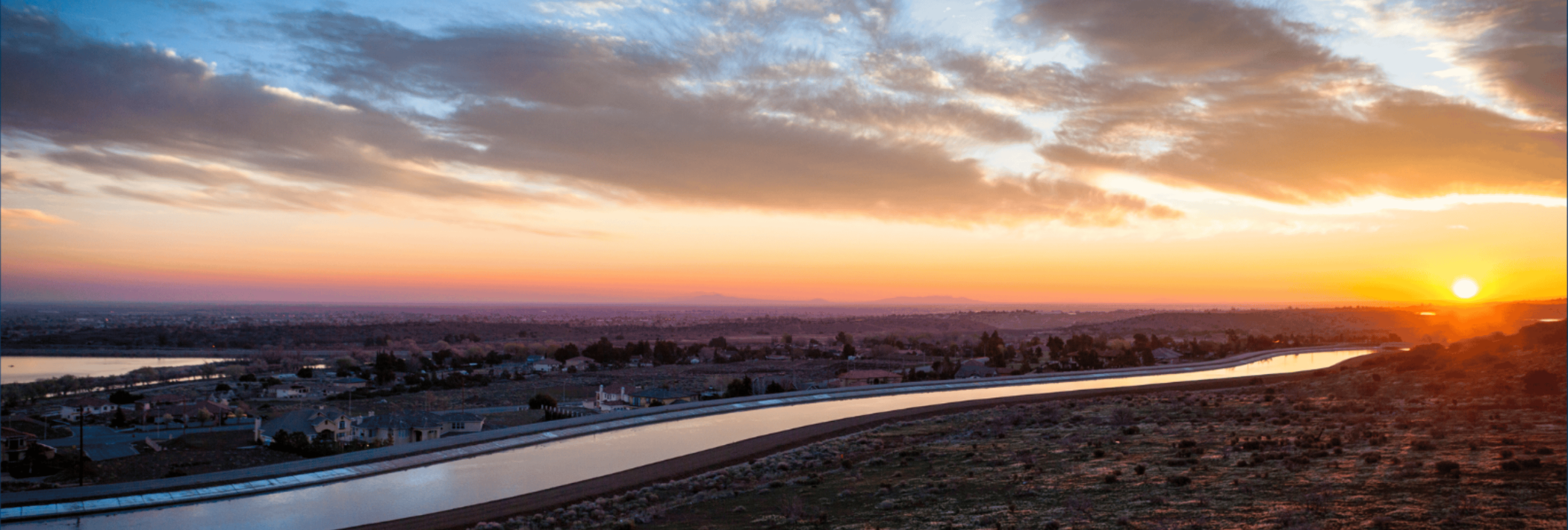 An overhead image of an aqueduct at sunset.