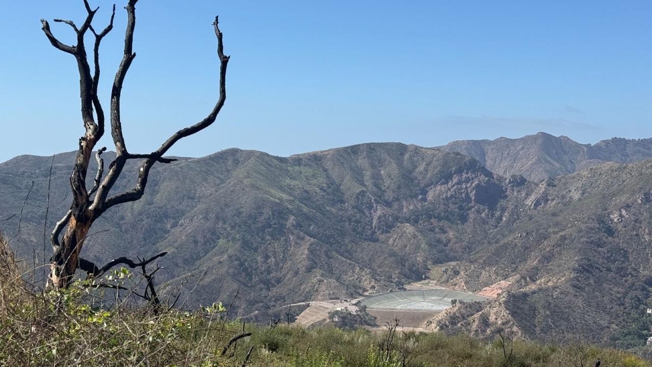 An image of an empty reservoir after a fire.