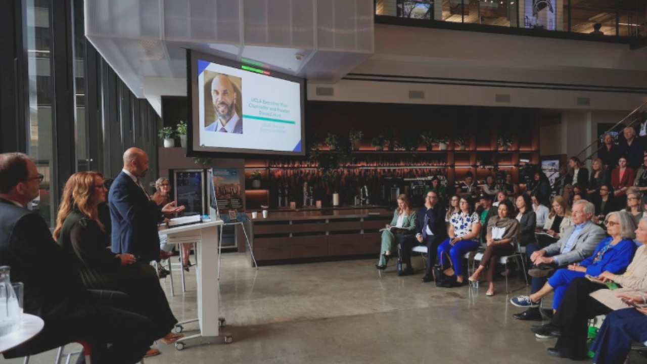 Executive Vice Chancellor and Provost Darnell Hunt delivers a speech to a crowd.