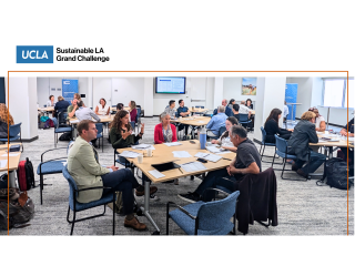 A group of people in a room discussing things.